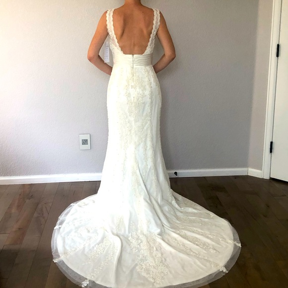 Brand new with tags unaltered lace wedding dress